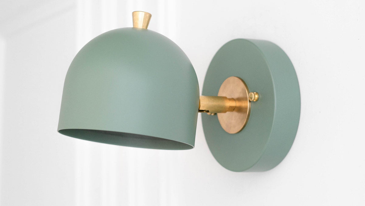 Green metal wall sconce with rounded shade and matte brass adjustable arm and mounting plate. - SCONCE MODEL NO. 0997