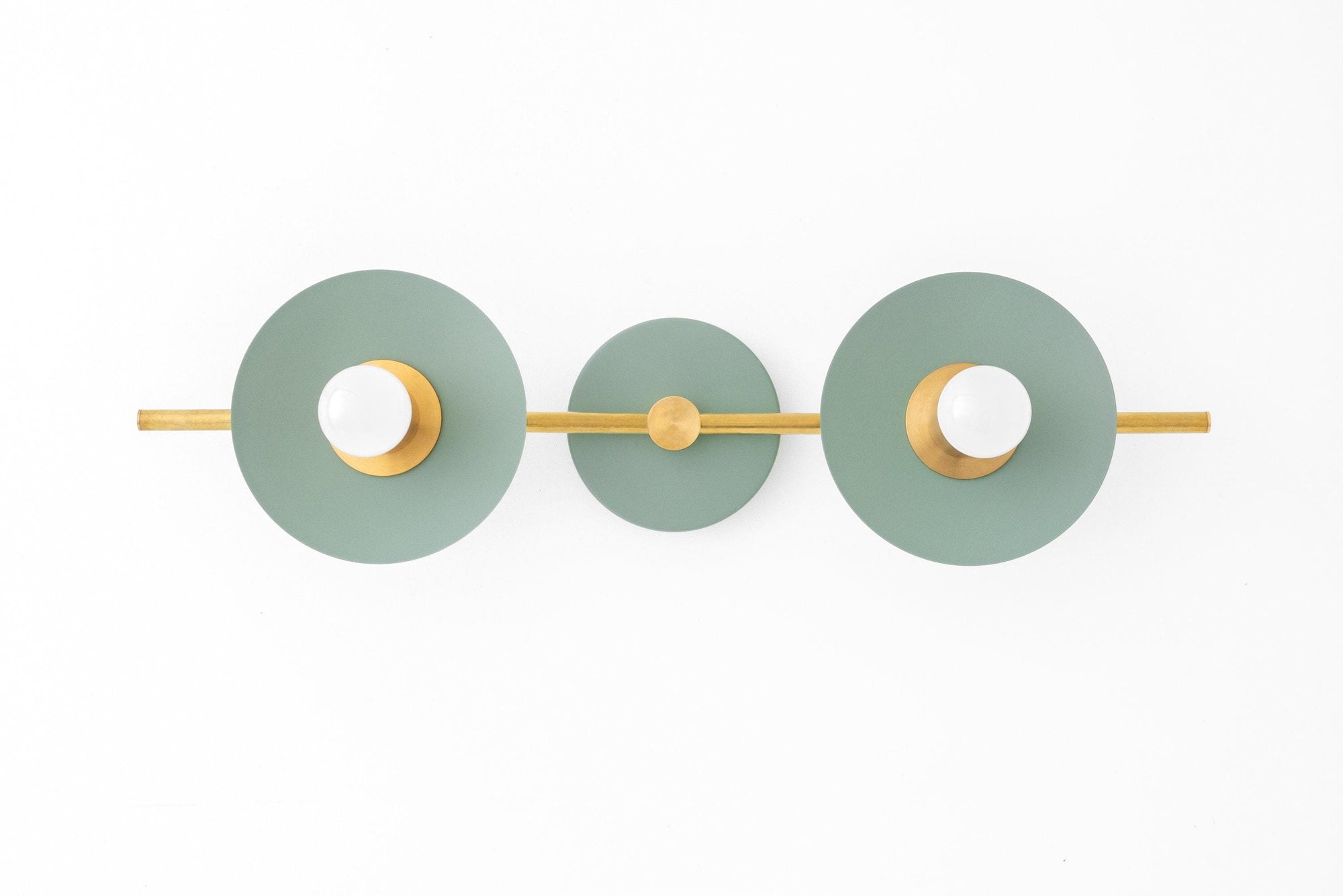 Raw brass 2-bulb vanity light with green Art Deco circular shades and bare bulbs. - VANITY LIGHT MODEL NO. 8151