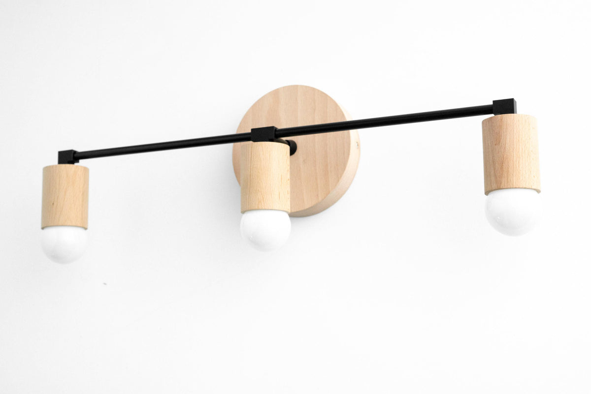 Modern 3-bulb vanity light with natural beech wood and black metal accents. - VANITY LIGHT MODEL NO. 4446