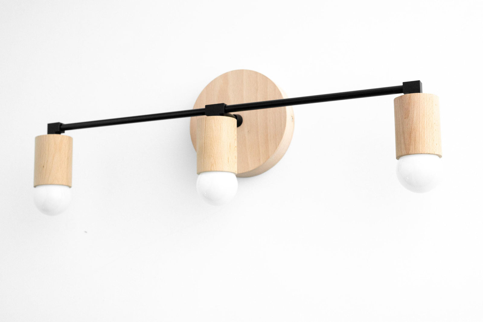 Modern 3-bulb vanity light with natural beech wood and black metal accents. - VANITY LIGHT MODEL NO. 4446