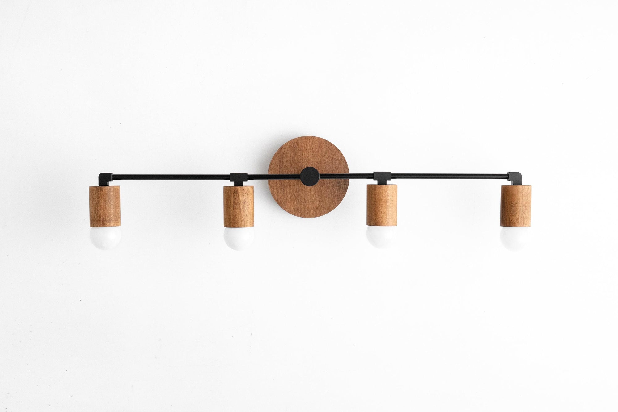 Four-bulb vanity light with black metal frame and natural wood cylindrical bulb holders. - VANITY LIGHT MODEL NO. 2017
