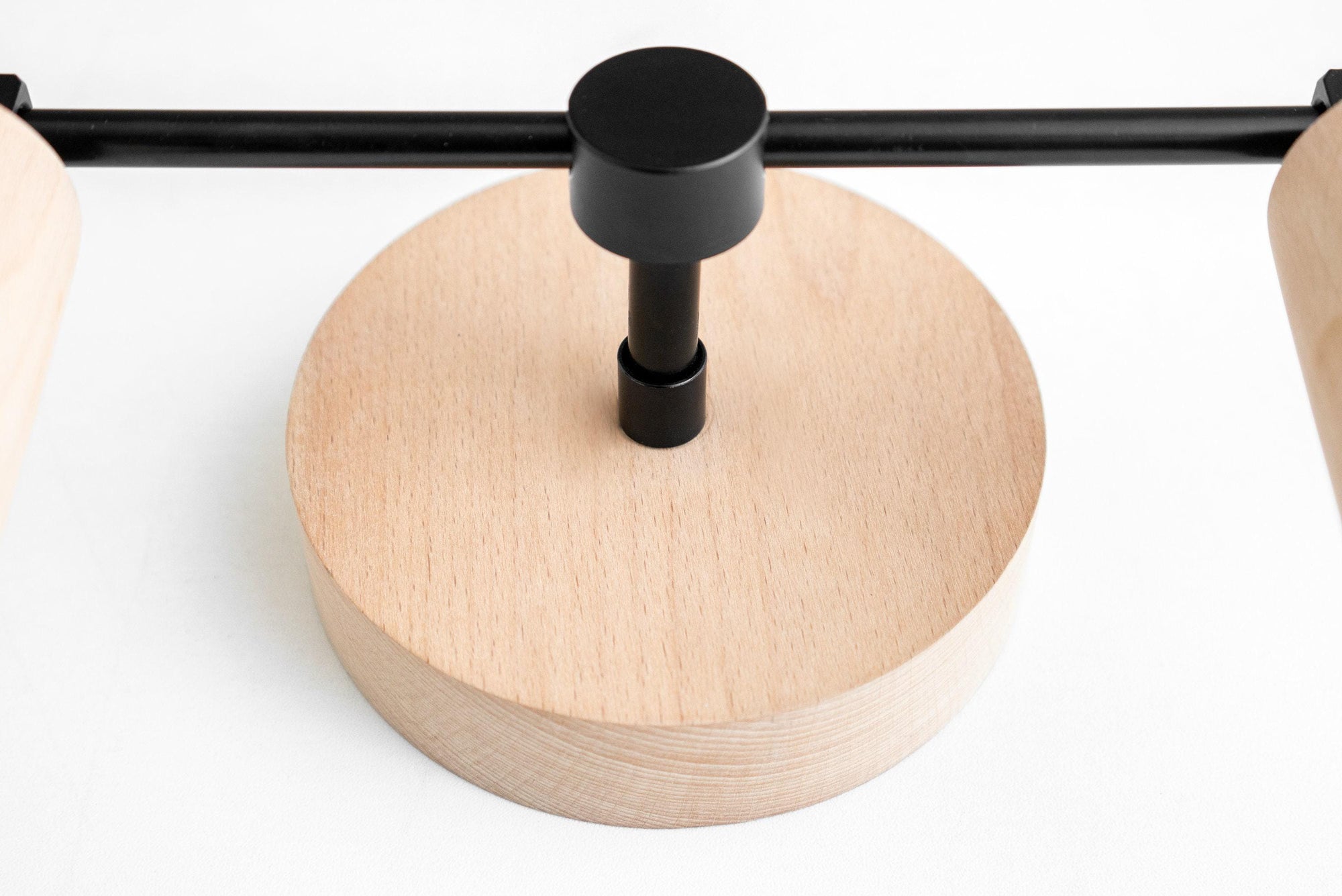 Natural oak wood base vanity light fixture with matte black metal rod and bulb holder. - VANITY LIGHT MODEL NO. 2017