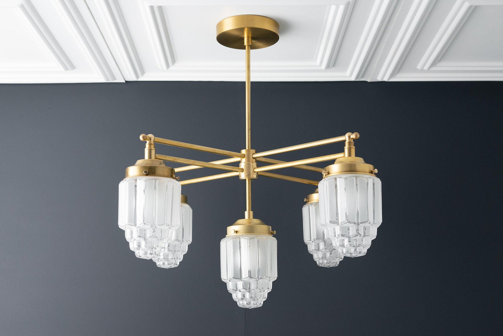 Raw brass Art Deco chandelier with five layered frosted glass globes hanging from sleek arms. - CHANDELIER MODEL NO. 5830