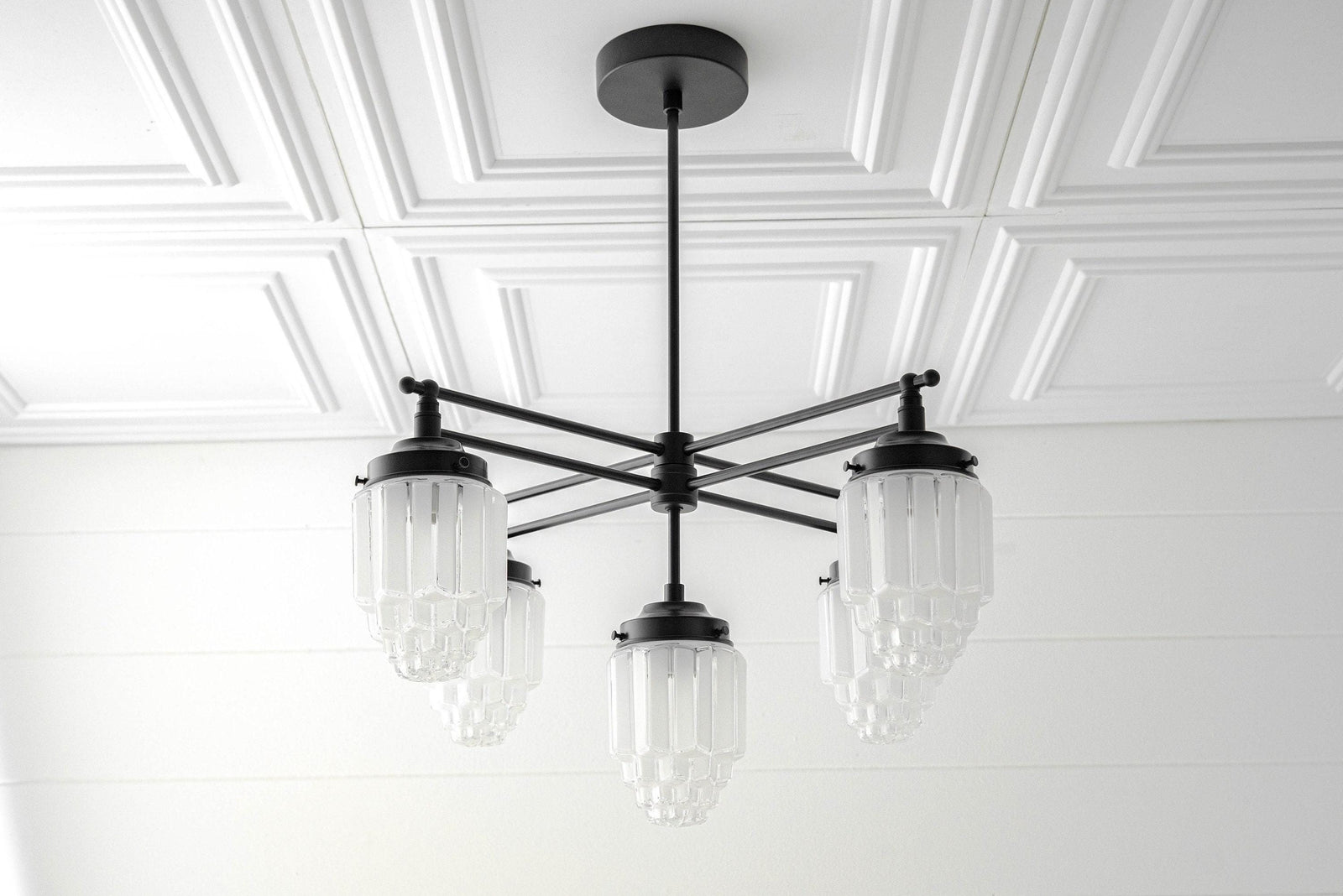 Black Art Deco chandelier with three clear globe glass shades and a metal rod mount. - CHANDELIER MODEL NO. 5830