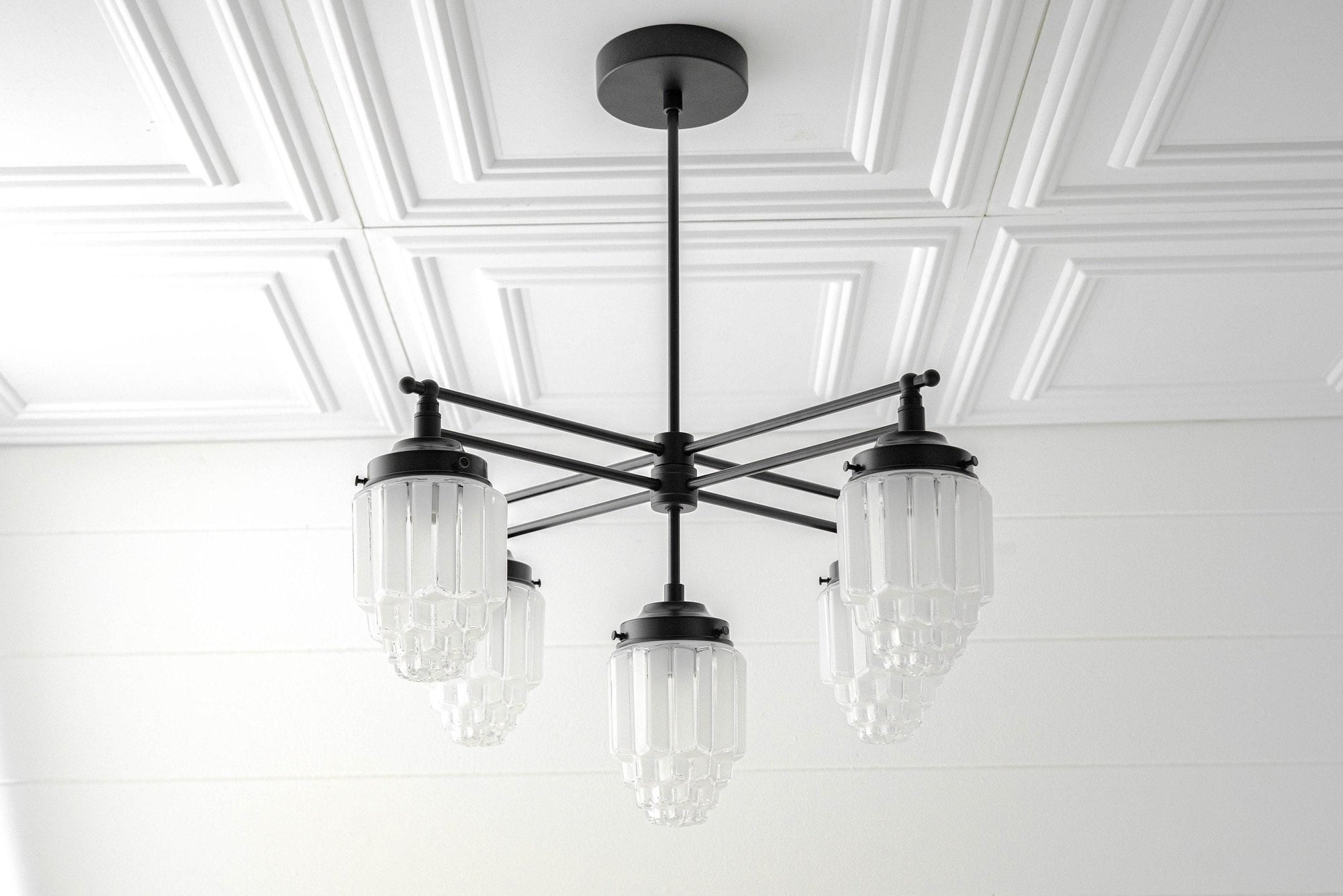 Black Art Deco chandelier with three clear globe glass shades and a metal rod mount. - CHANDELIER MODEL NO. 5830