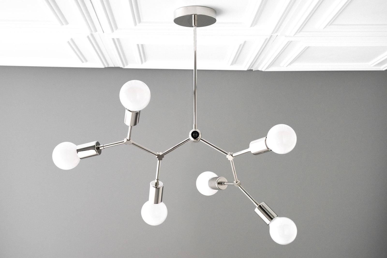 Polished nickel Art Deco chandelier with six exposed globe bulbs and angular arms. - CHANDELIER MODEL NO. 2523