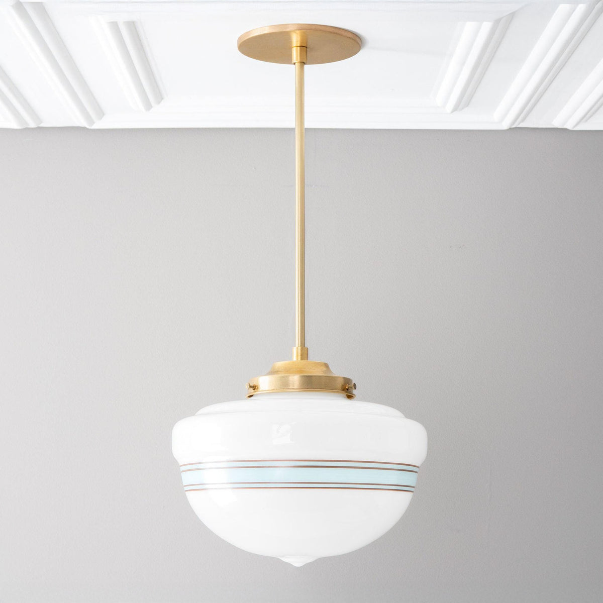 Pendant in Raw or Sealed Brass with a striped opal glass schoolhouse shade on a straight rod. - PENDANT MODEL No. 9927