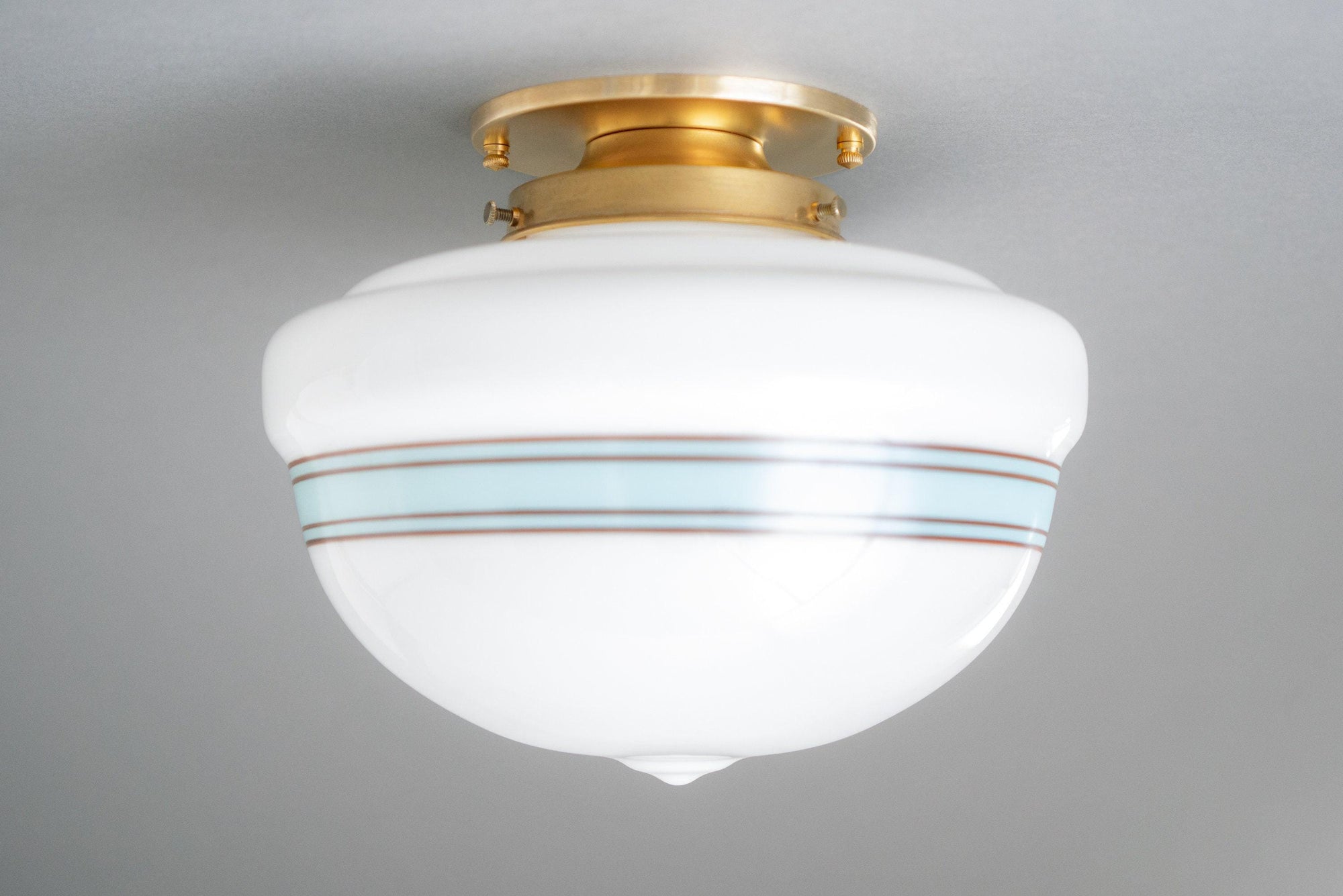 Art Deco flush mount ceiling light with white glass globe and antique brass fixture. - CEILING LIGHT MODEL NO. 9927
