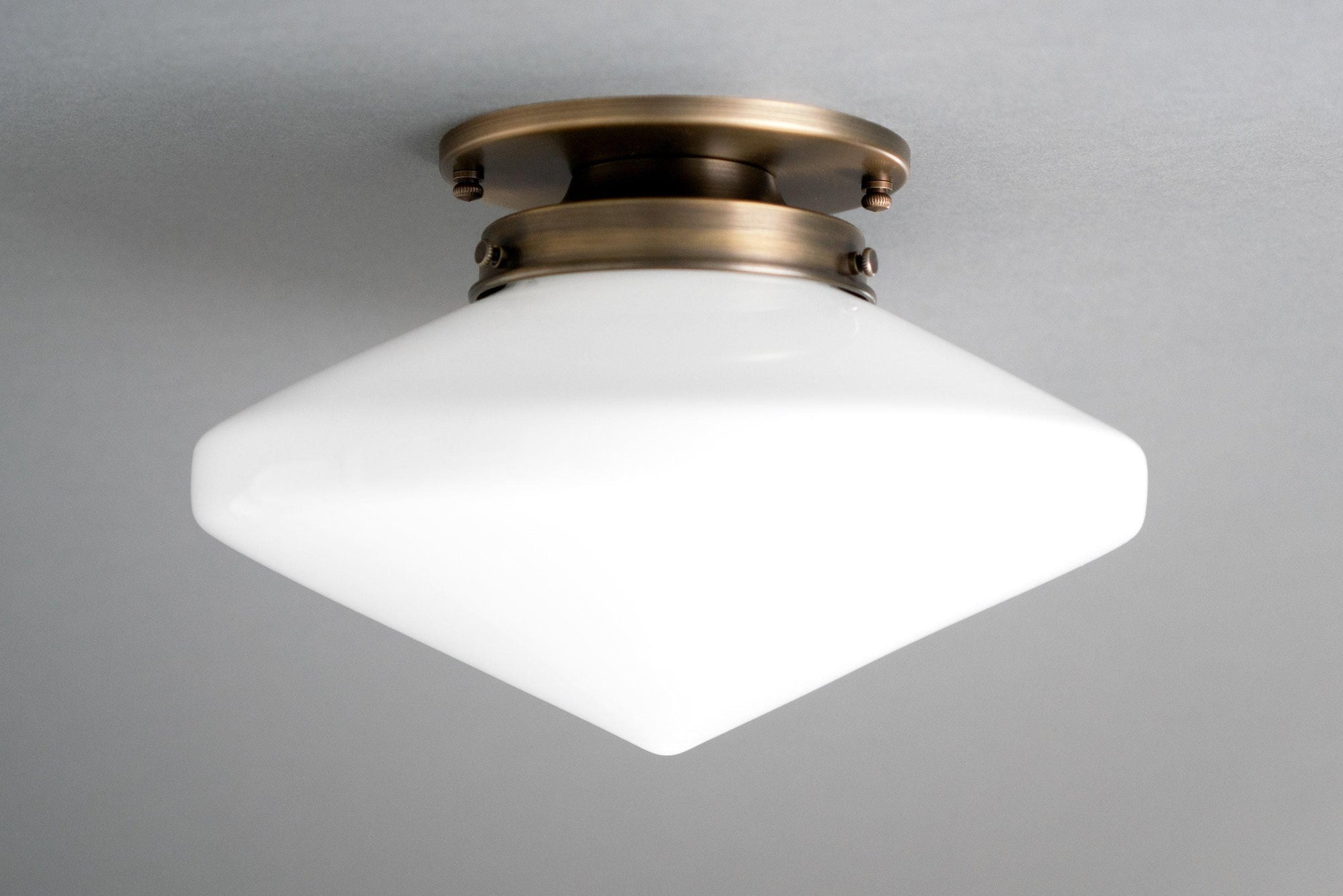 Flush mount ceiling light with white frosted square glass globe and antique brass base. - CEILING LIGHT MODEL NO. 5862