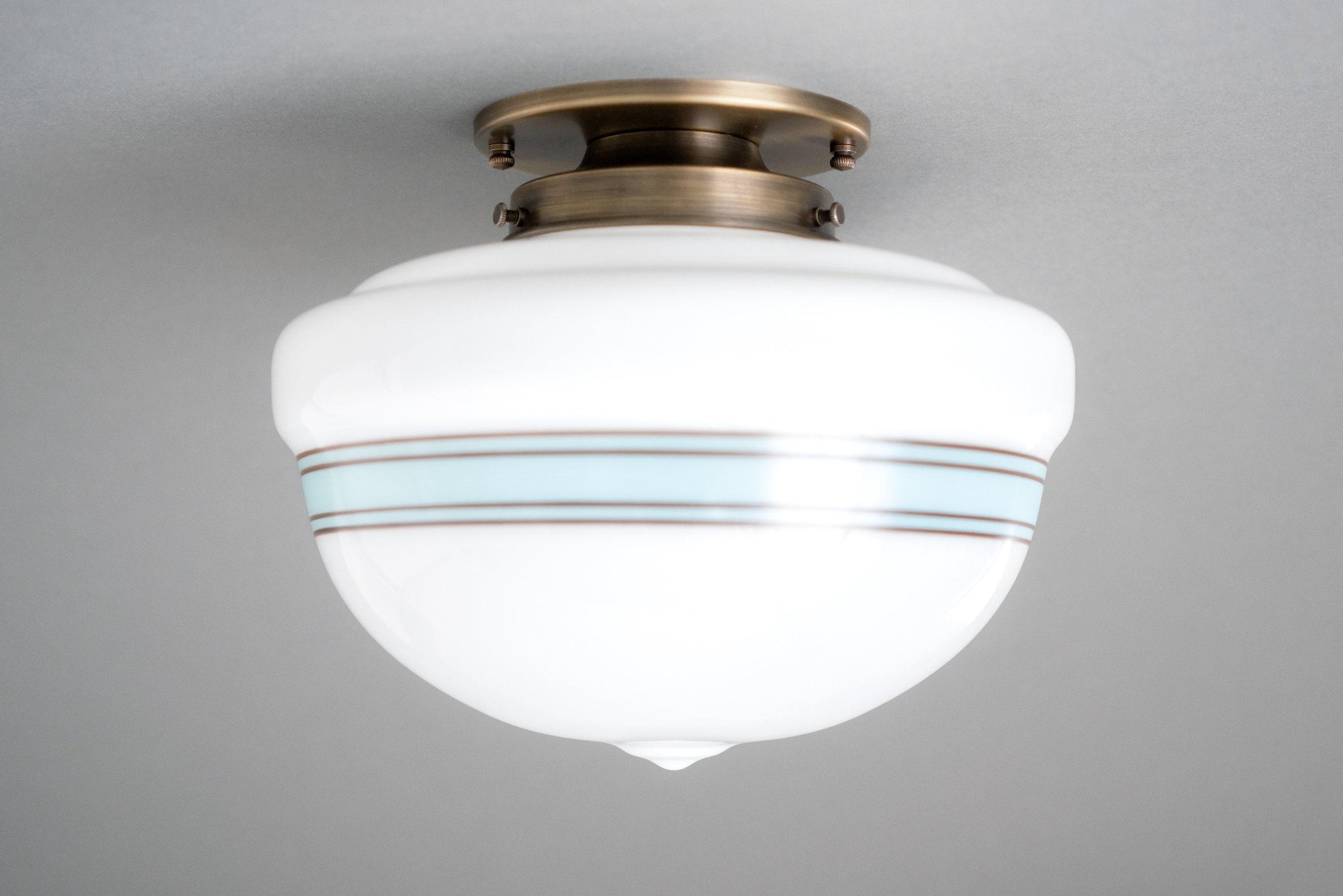 Art Deco flush mount ceiling light with white glass globe and antique brass finish. - CEILING LIGHT MODEL NO. 9927