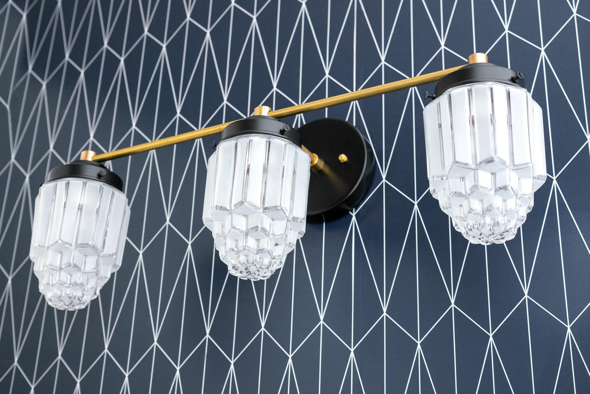 Art Deco style vanity light with three faceted globe bulbs and black and brass finish. - VANITY LIGHT MODEL NO. 3918