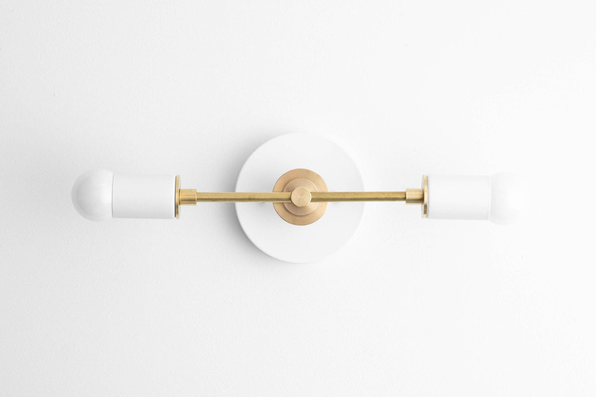 Art Deco vanity light with a polished brass center and two frosted white glass globes on either end. - VANITY LIGHT MODEL NO. 8057