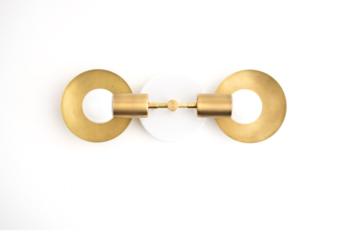 Mid-century modern vanity light with two raw brass circular backplates and exposed bulbs. - VANITY LIGHT MODEL NO. 2945