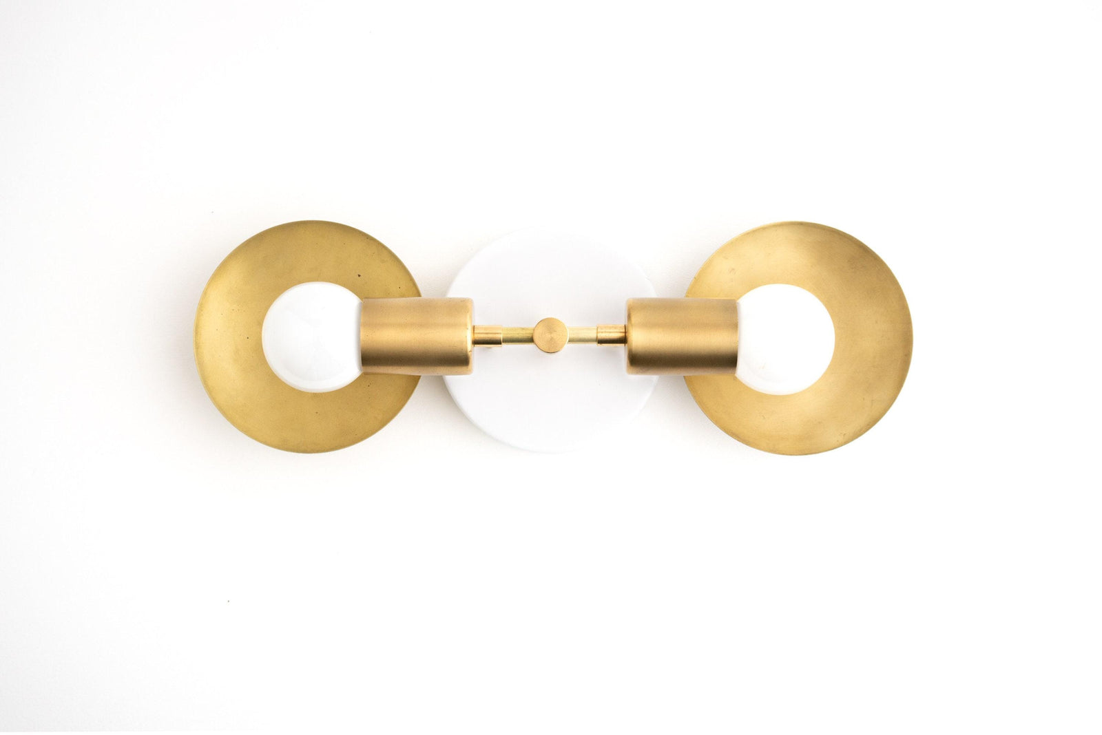 Mid-century modern vanity light with two raw brass circular backplates and exposed bulbs. - VANITY LIGHT MODEL NO. 2945