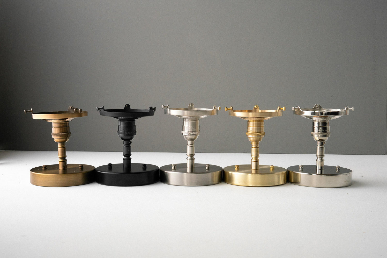 Five Art Deco semi-flush globe ceiling lights in raw brass, black, brushed nickel, antique brass, and polished nickel. - CEILING LIGHT MODEL NO. 4560
