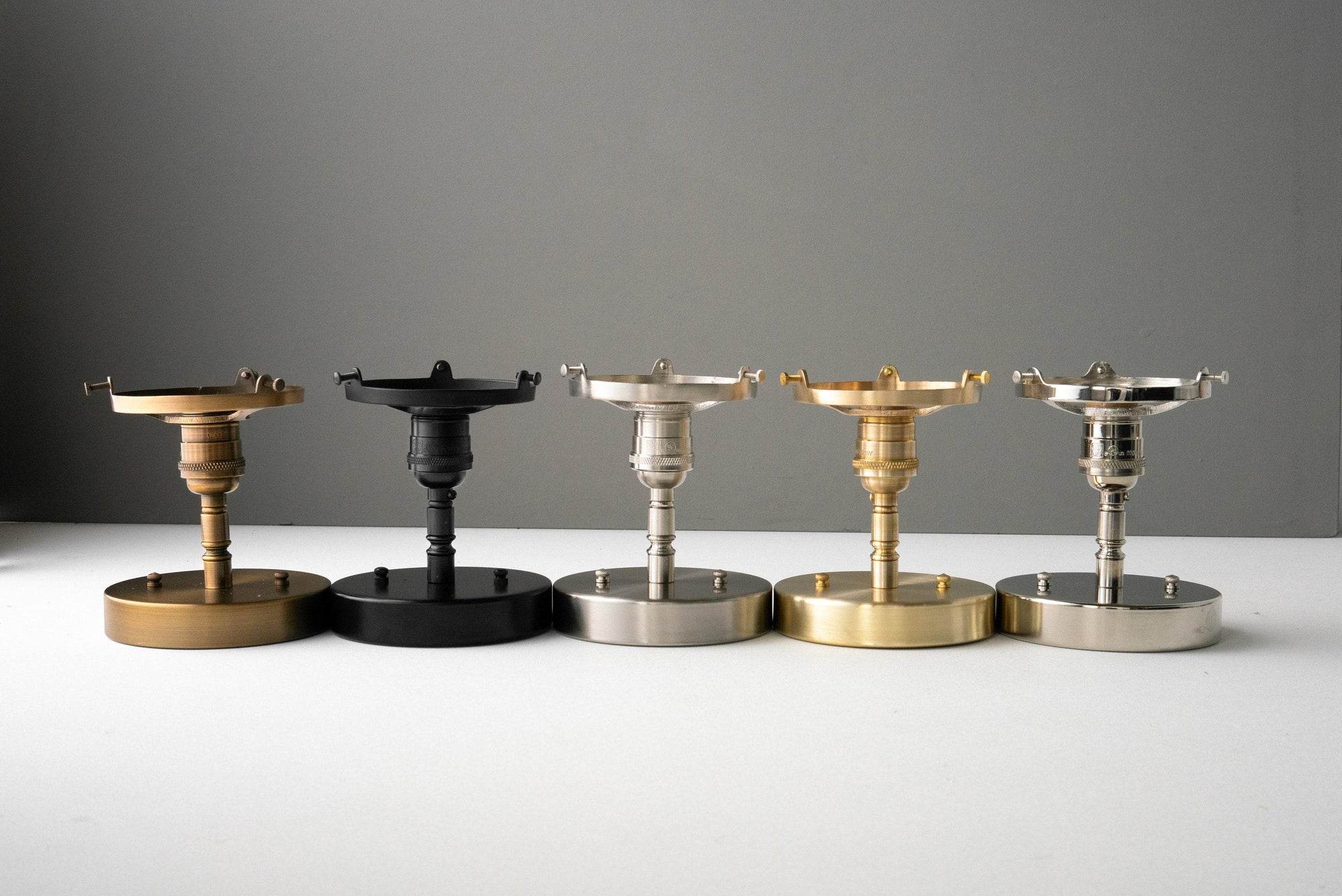 Five Art Deco semi-flush globe ceiling lights in raw brass, black, brushed nickel, antique brass, and polished nickel. - CEILING LIGHT MODEL NO. 4560