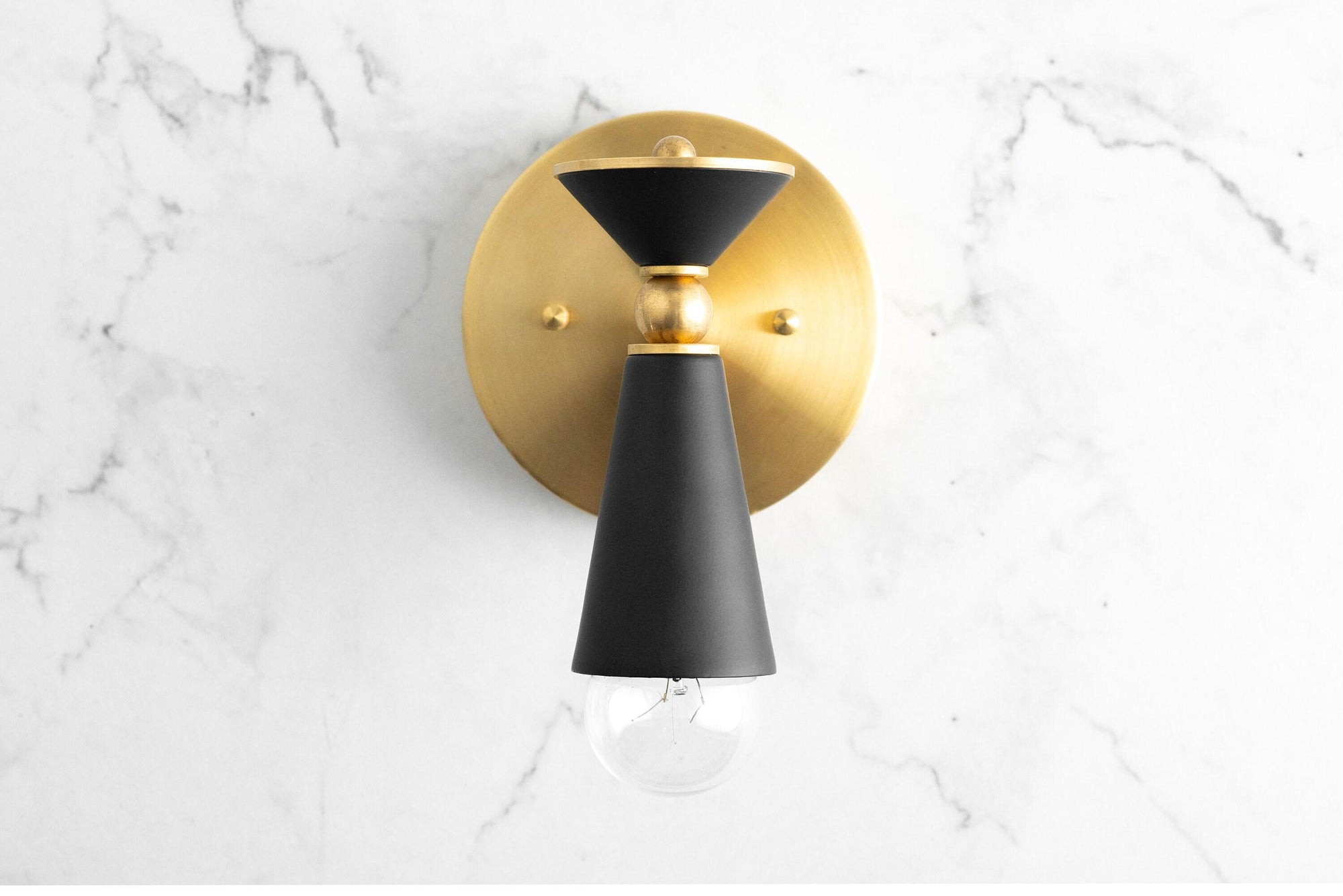 Art Deco brass and black metal wall sconce with bare bulb and cone-shaped shade. - SCONCE MODEL NO. 8393