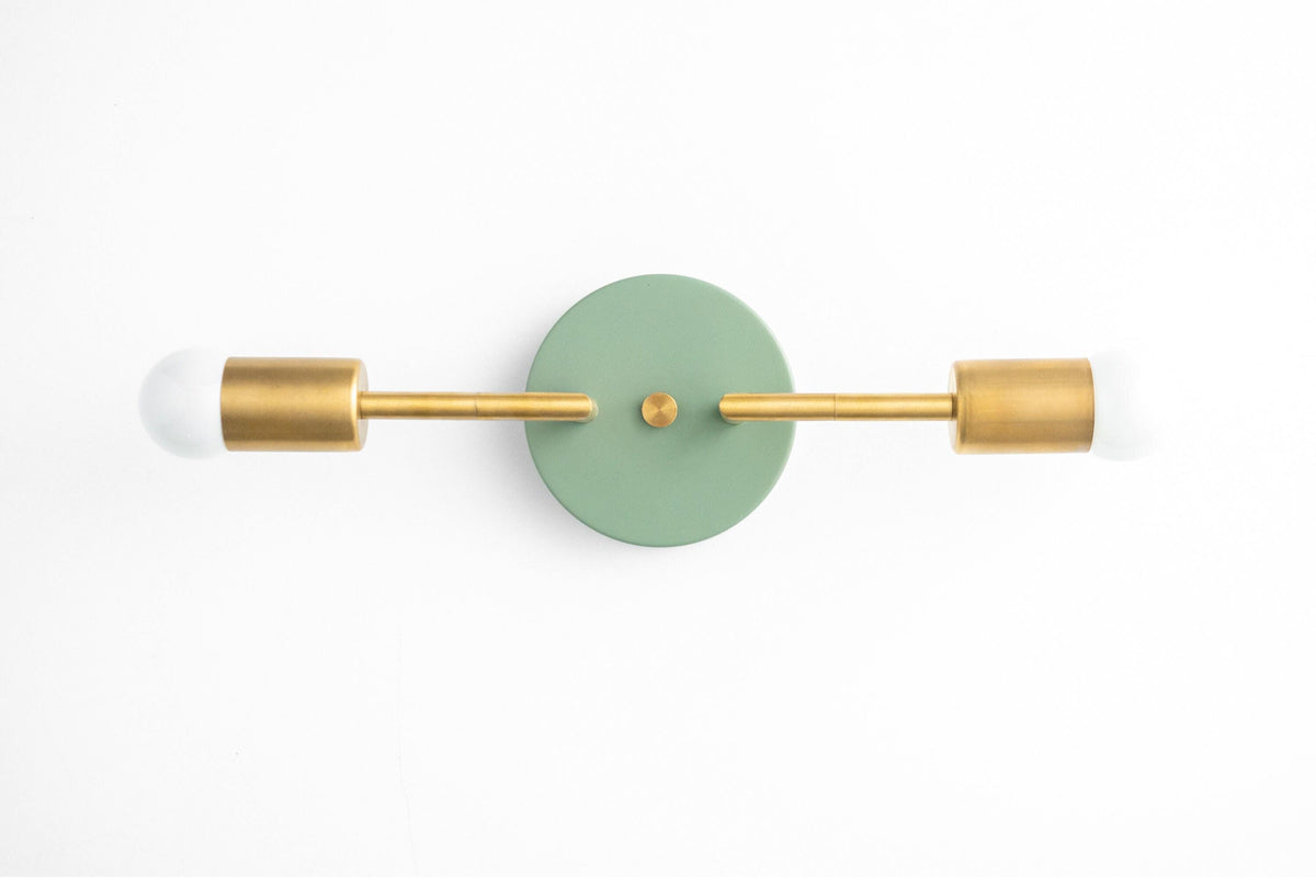 Mid-century modern 2-bulb vanity light with raw brass finish and green circular wall mount. - VANITY LIGHT MODEL NO. 1938
