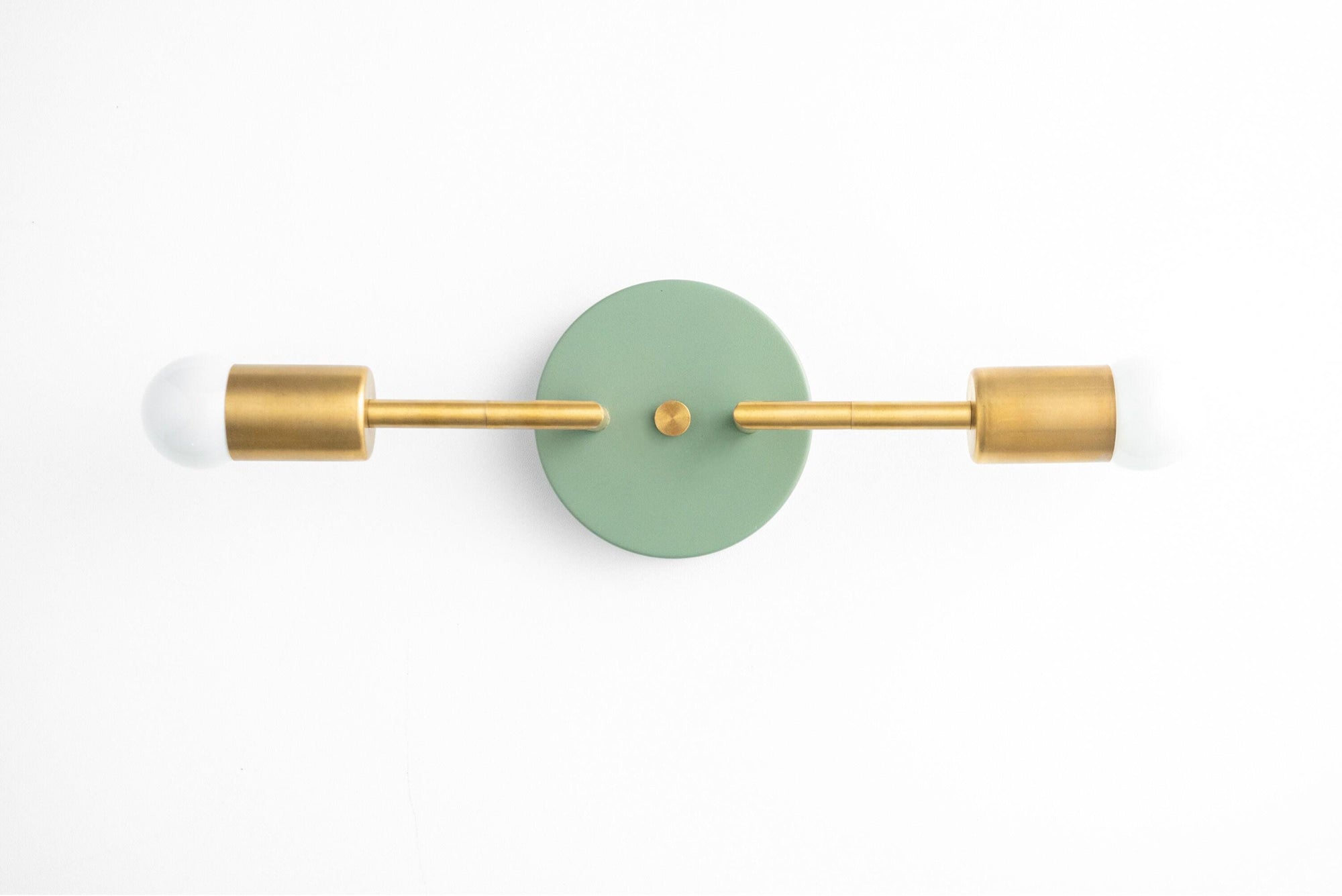 Mid-century modern 2-bulb vanity light with raw brass finish and green circular wall mount. - VANITY LIGHT MODEL NO. 1938