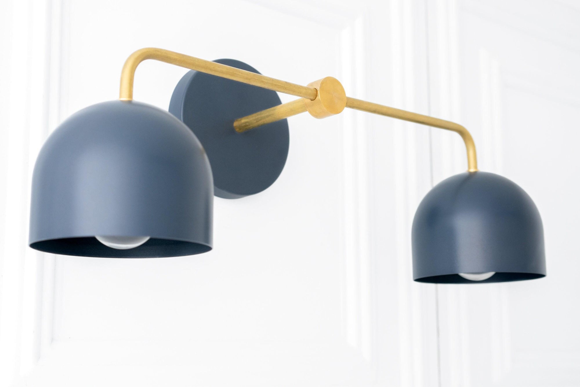 Mid-century modern vanity light with raw brass arm and two coal blue dome shades. - VANITY LIGHT MODEL NO. 2082