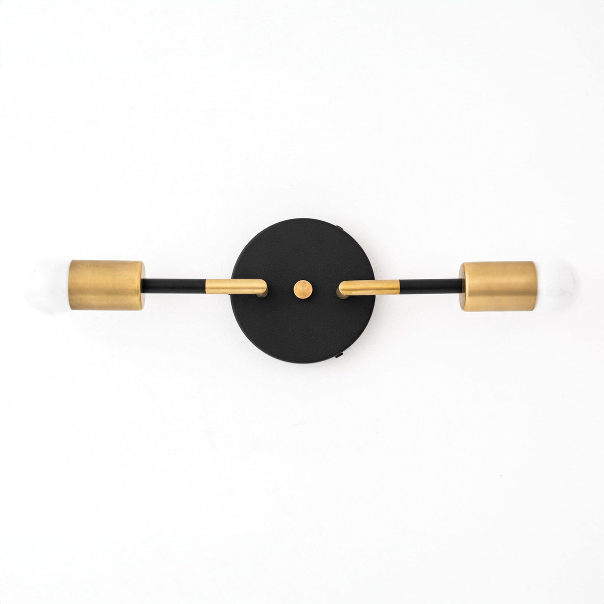 Art Deco vanity light with two raw brass bulbs and a round black wall mount. - VANITY LIGHT MODEL NO. 1938