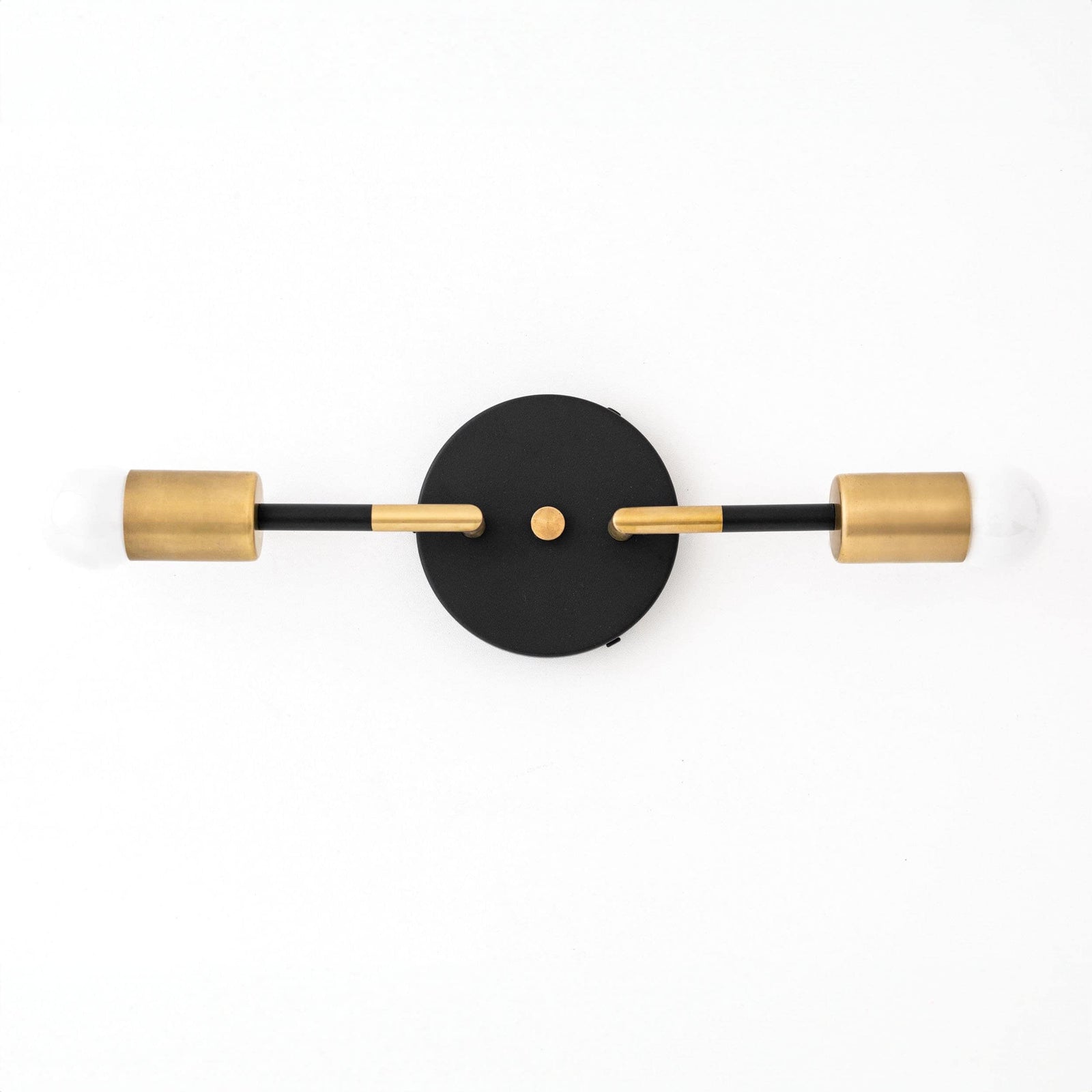 Art Deco vanity light with two raw brass bulbs and a round black wall mount. - VANITY LIGHT MODEL NO. 1938