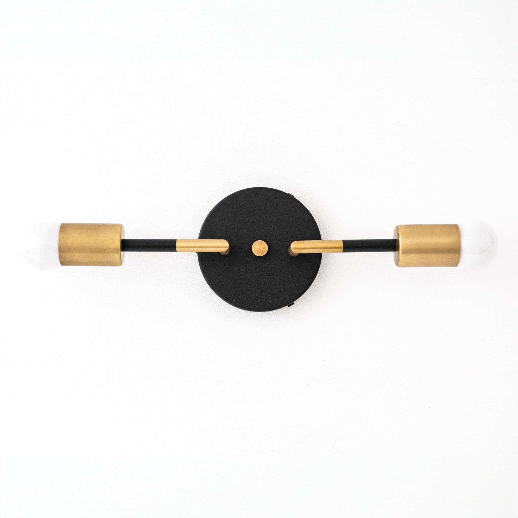 Art Deco vanity light with two raw brass bulbs and a round black wall mount. - VANITY LIGHT MODEL NO. 1938