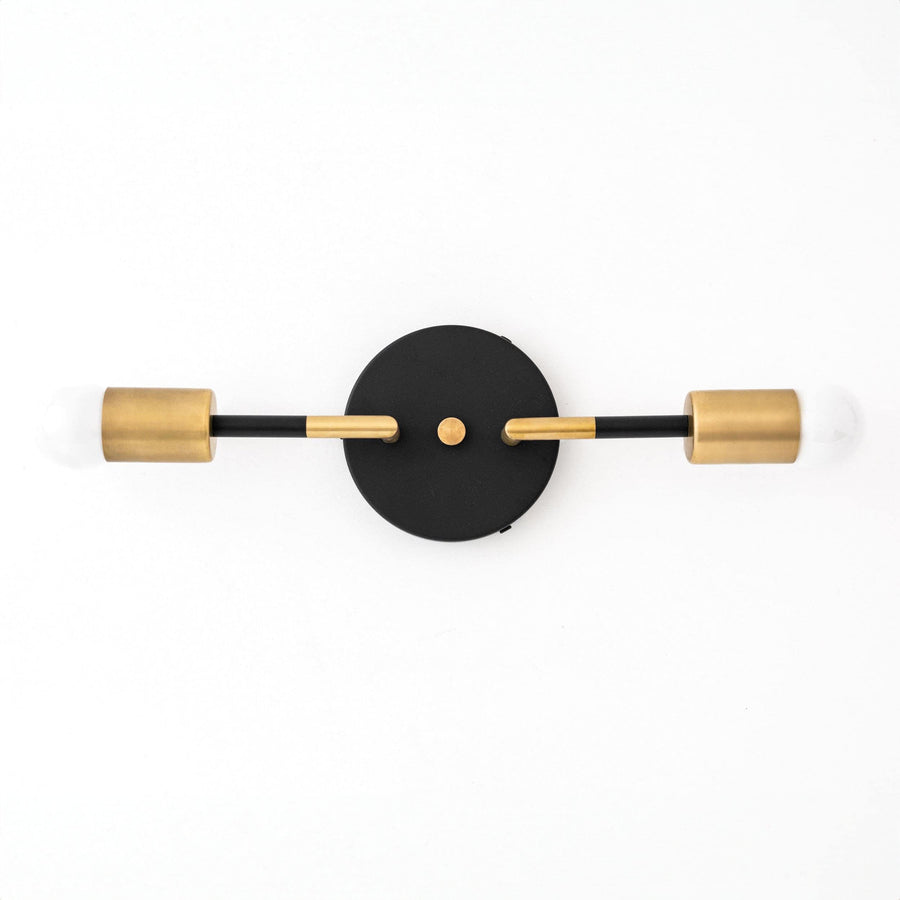 Art Deco vanity light with two raw brass bulbs and a round black wall mount. - VANITY LIGHT MODEL NO. 1938