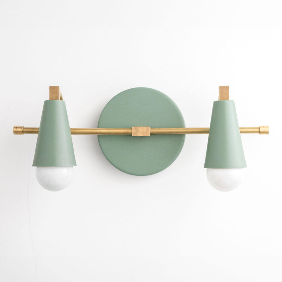 Mid-century modern vanity light with two green conical shades and raw brass horizontal bar and round backplate. - VANITY LIGHT MODEL NO. 1229