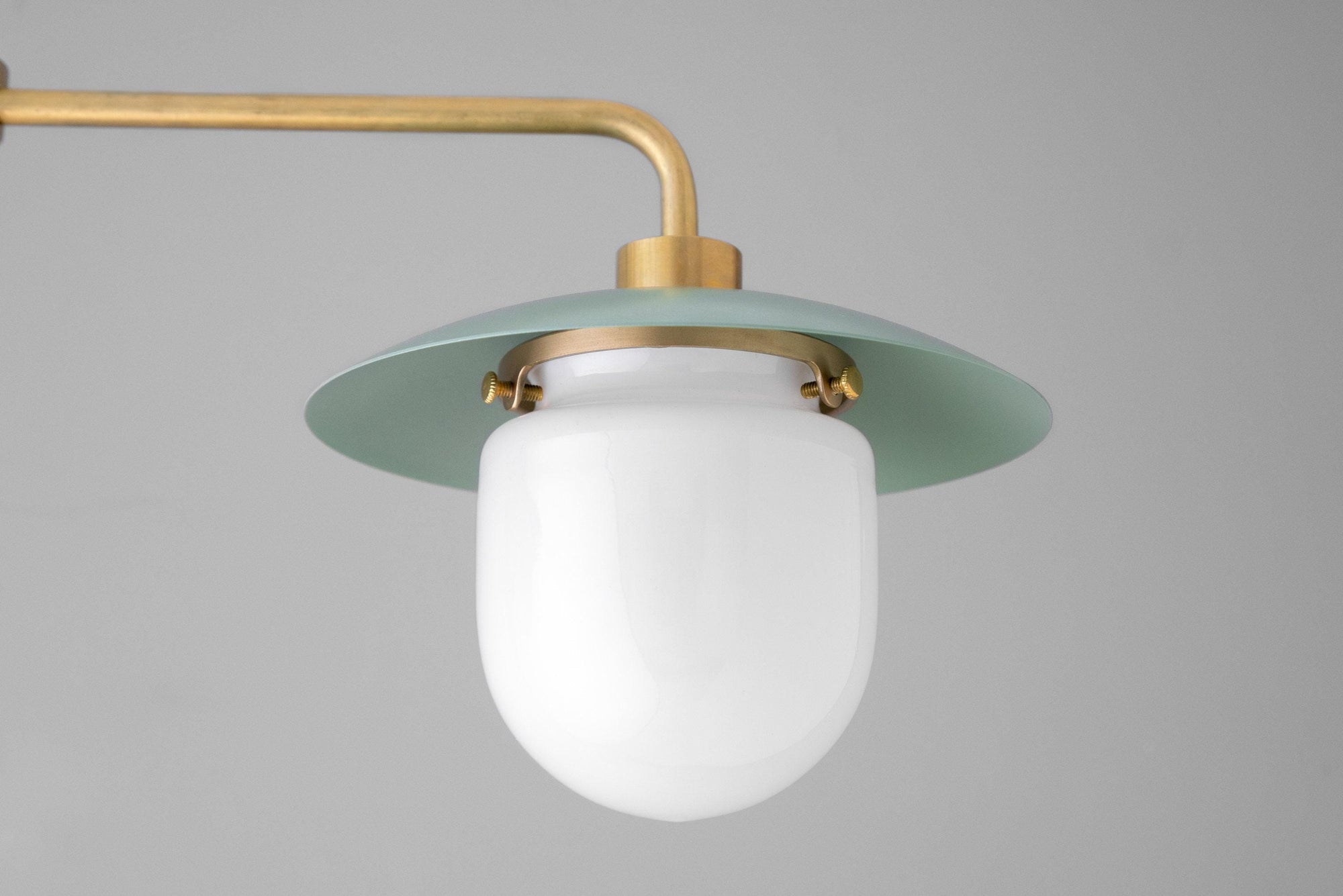 Mid-century modern chandelier with green brass fixture and white globe shade. - CHANDELIER MODEL NO. 1727