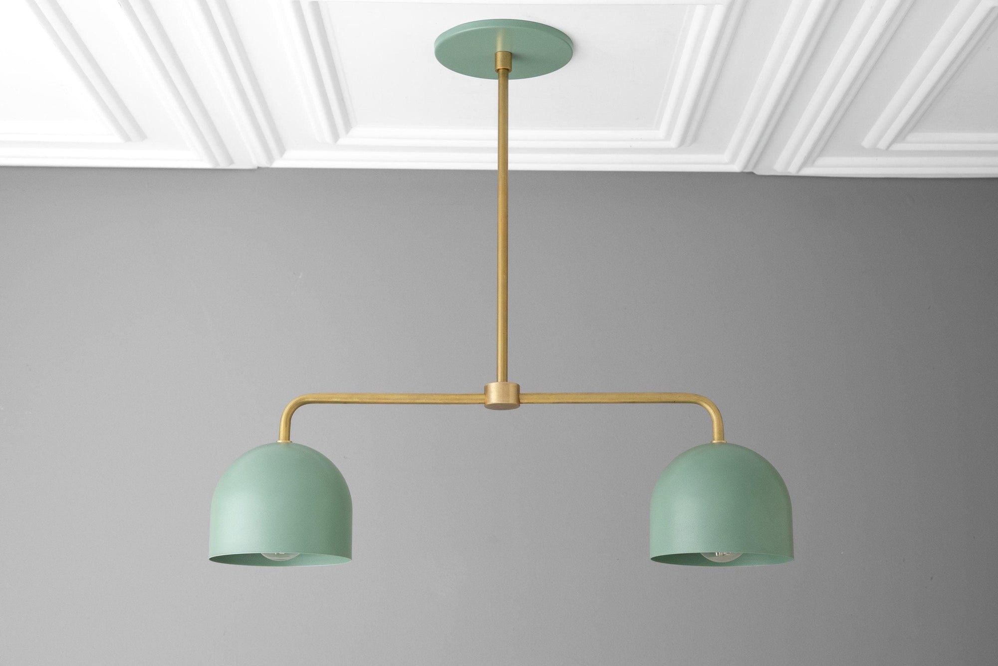 Industrial chandelier with brass rod and two matte green dome shades suspended from ceiling mount. - CHANDELIER MODEL NO. 5719