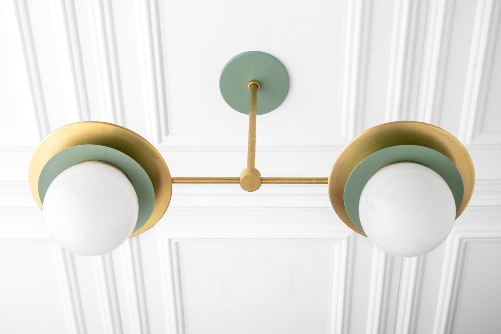Mid-century modern brass chandelier with green accents and two white globe shades on ceiling mount. - CHANDELIER MODEL NO. 3792