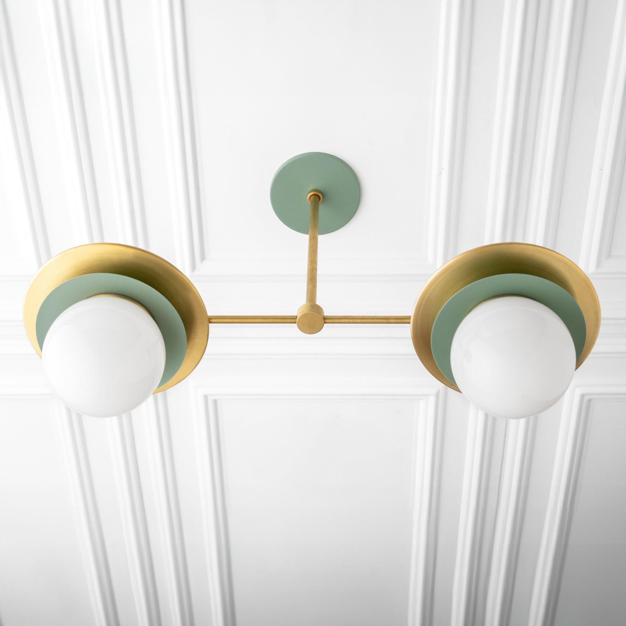 Mid-century modern chandelier with two white globe lights, green and brass accents, mounted on ceiling. - CHANDELIER MODEL NO. 3792