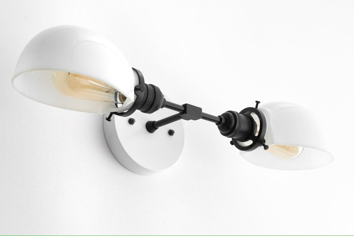 Mid-century modern white and black two-bulb vanity light with rounded shades and adjustable arms. - VANITY LIGHT MODEL NO. 1734