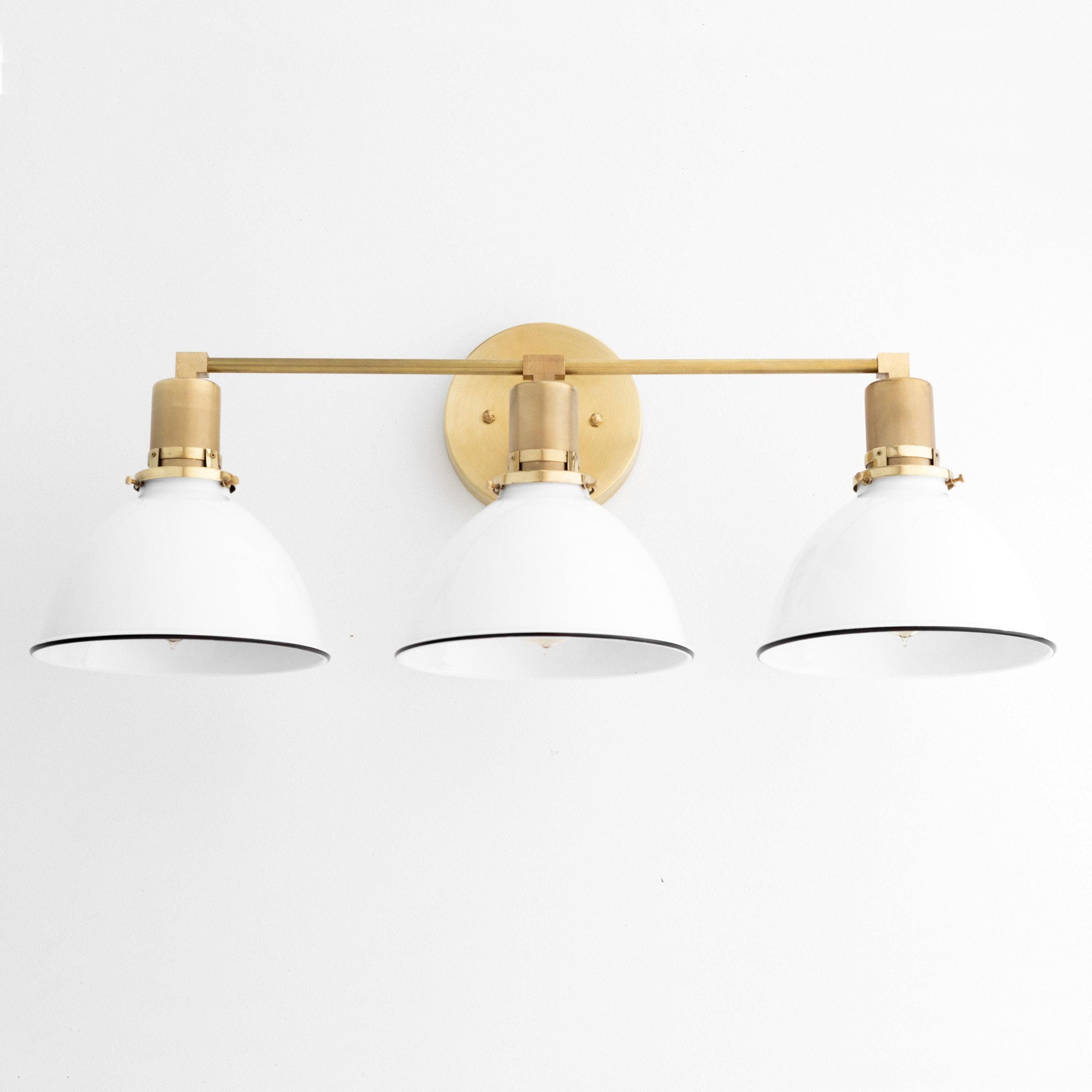 Mid-century modern 3-bulb vanity light with white metal shades and raw brass accents. - VANITY LIGHT MODEL NO. 2439