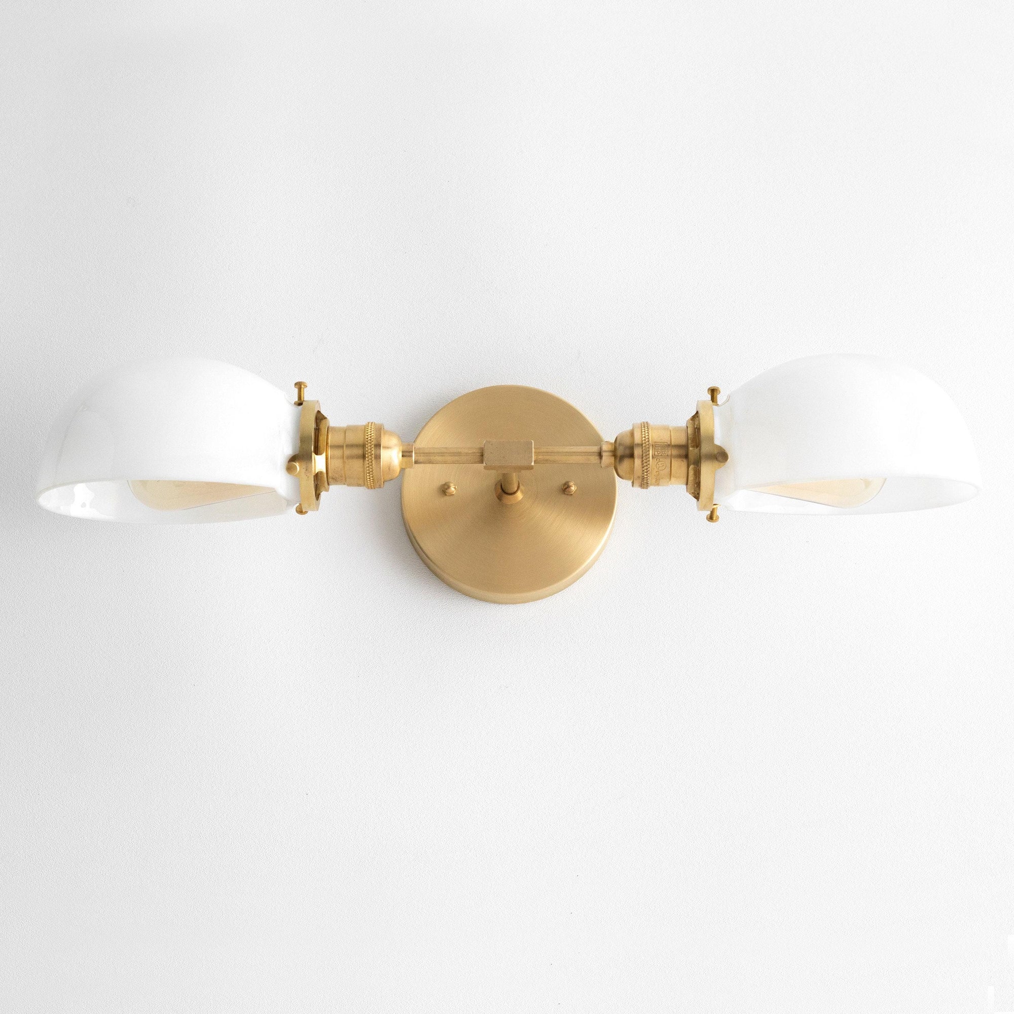 Mid-century modern vanity light with two white shades and raw brass finish wall mount. - VANITY LIGHT MODEL NO. 1734