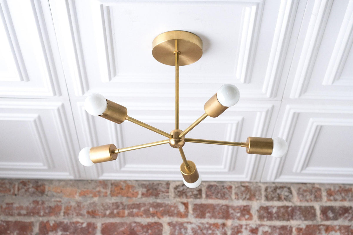 Mid-century modern chandelier with raw brass finish and six exposed white bulbs on black arms. - CHANDELIER MODEL NO. 6652