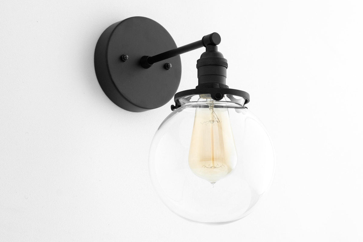 Black metal wall sconce with clear globe and visible filament bulb, mid-century modern style. - SCONCE MODEL NO. 5456