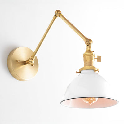 Mid-century modern adjustable wall sconce in raw brass with white conical shade and exposed bulb. - SCONCE MODEL NO. 8551