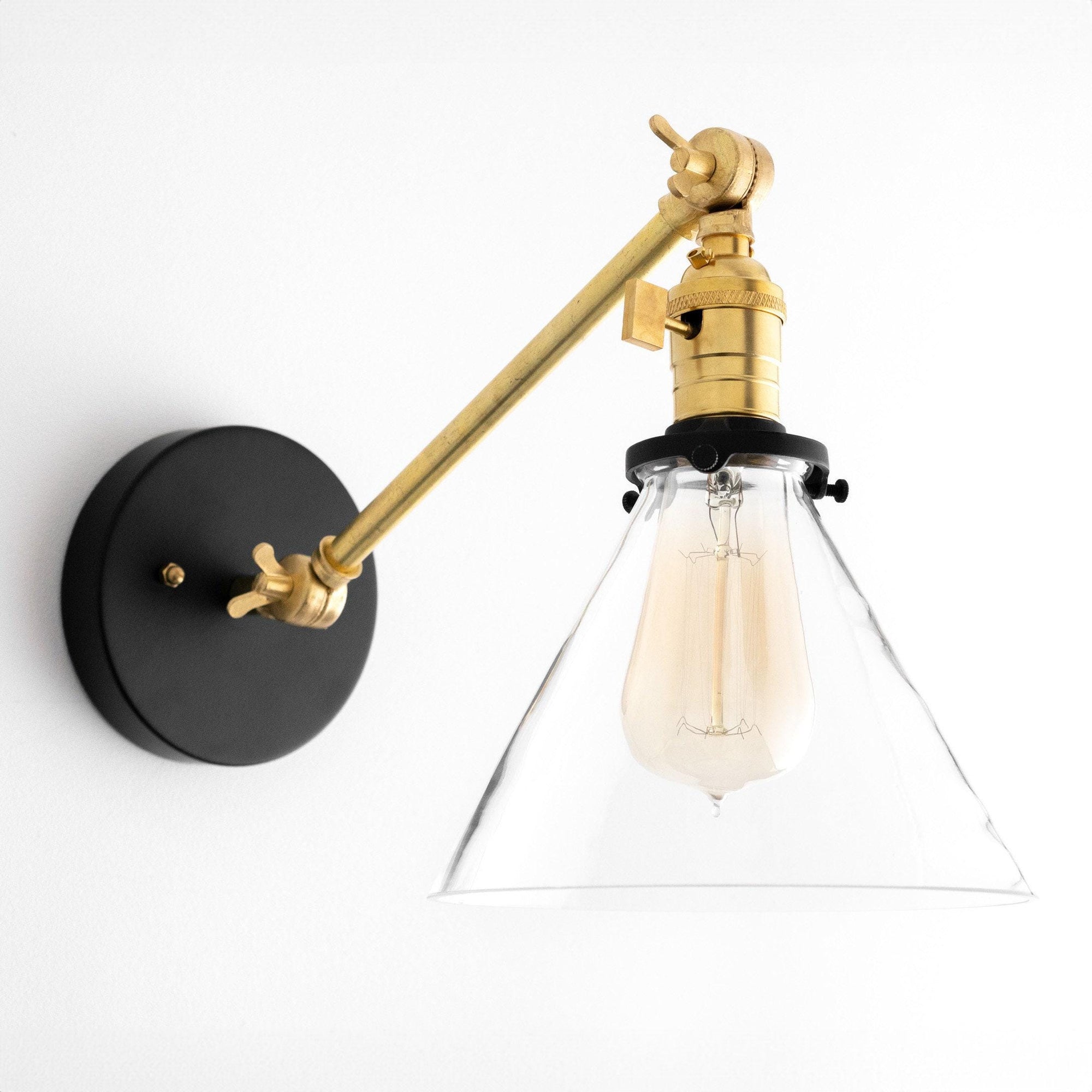 Mid-century modern wall sconce with adjustable brass arm and clear glass conical shade. - SCONCE MODEL NO. 7962