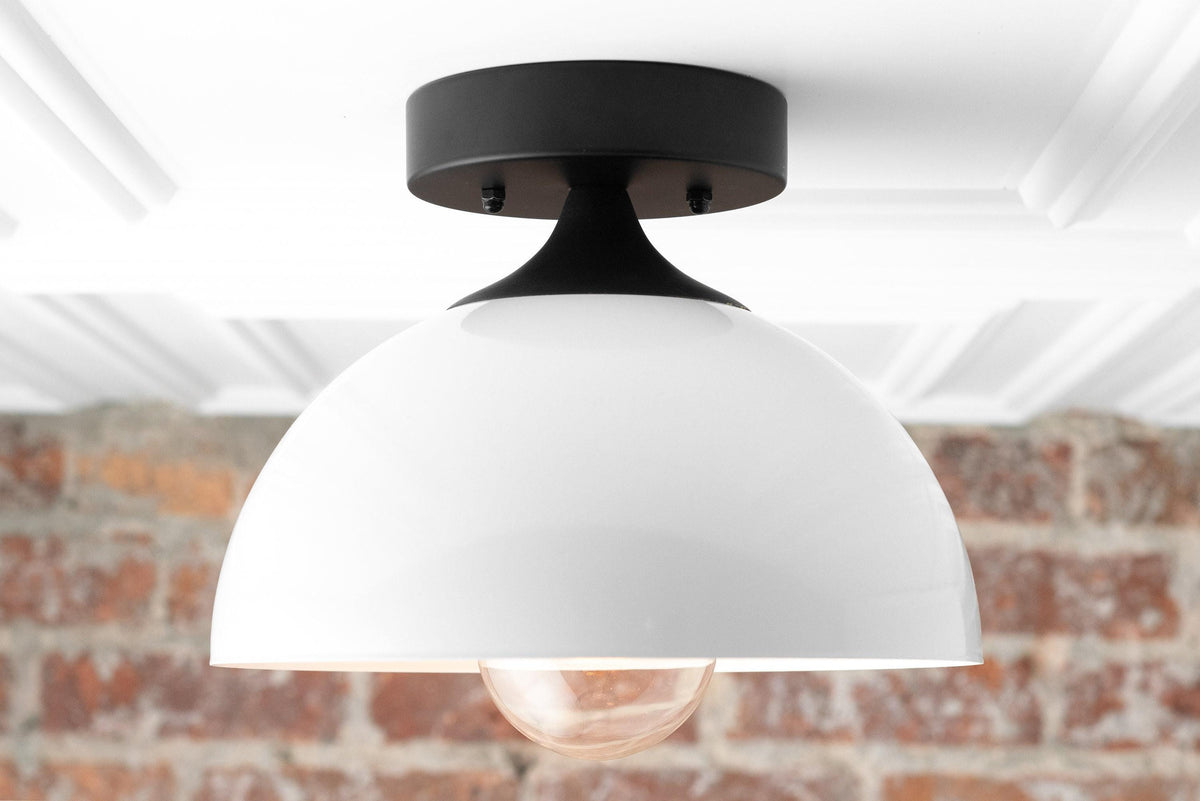 Mid-century modern semi-flush ceiling light with black metal base and large white dome shade revealing exposed bulb. - CEILING LIGHT MODEL NO. 8510