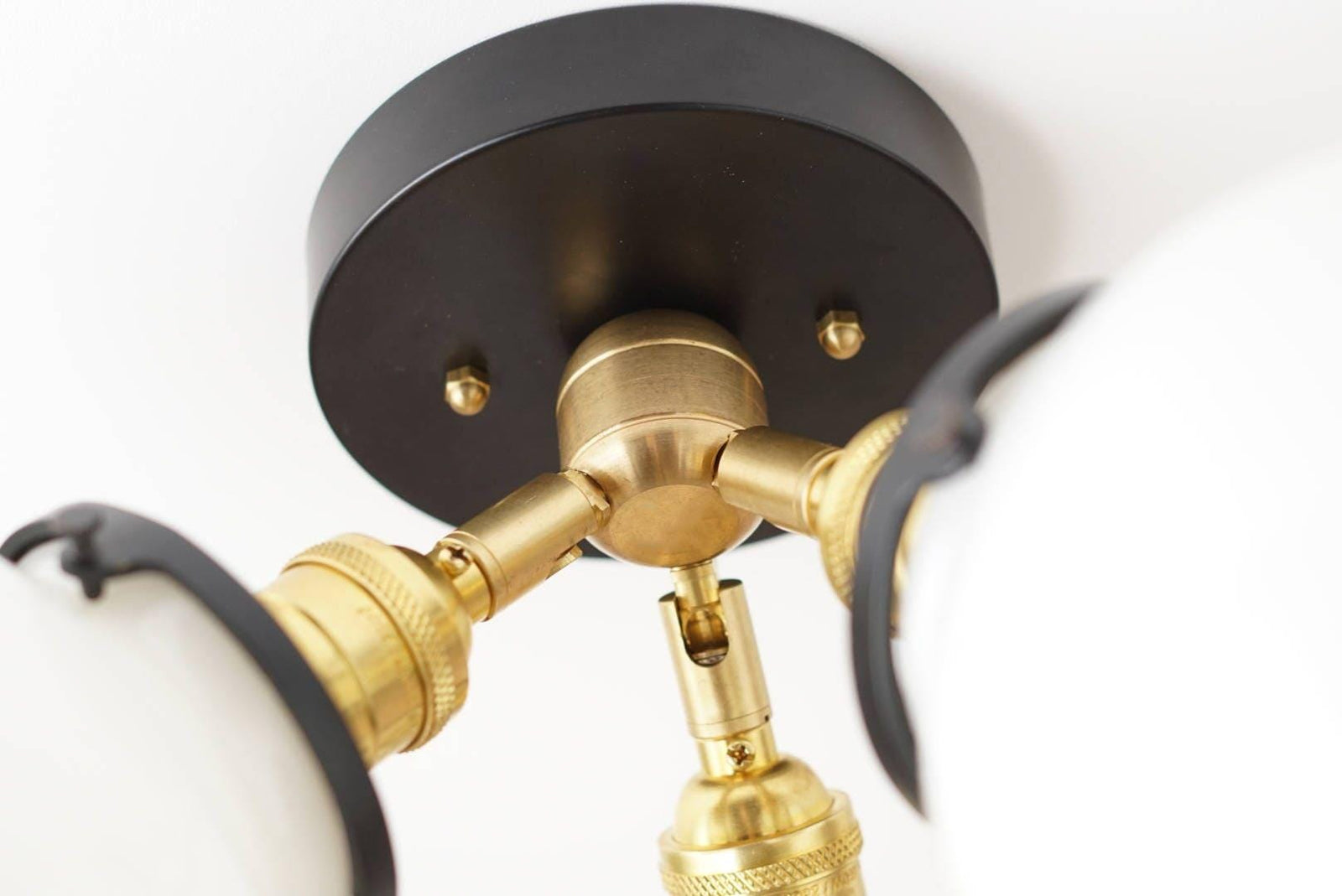 Mid-century modern flush mount ceiling light with black round base and brass fittings. - CEILING LIGHT MODEL NO. 0210