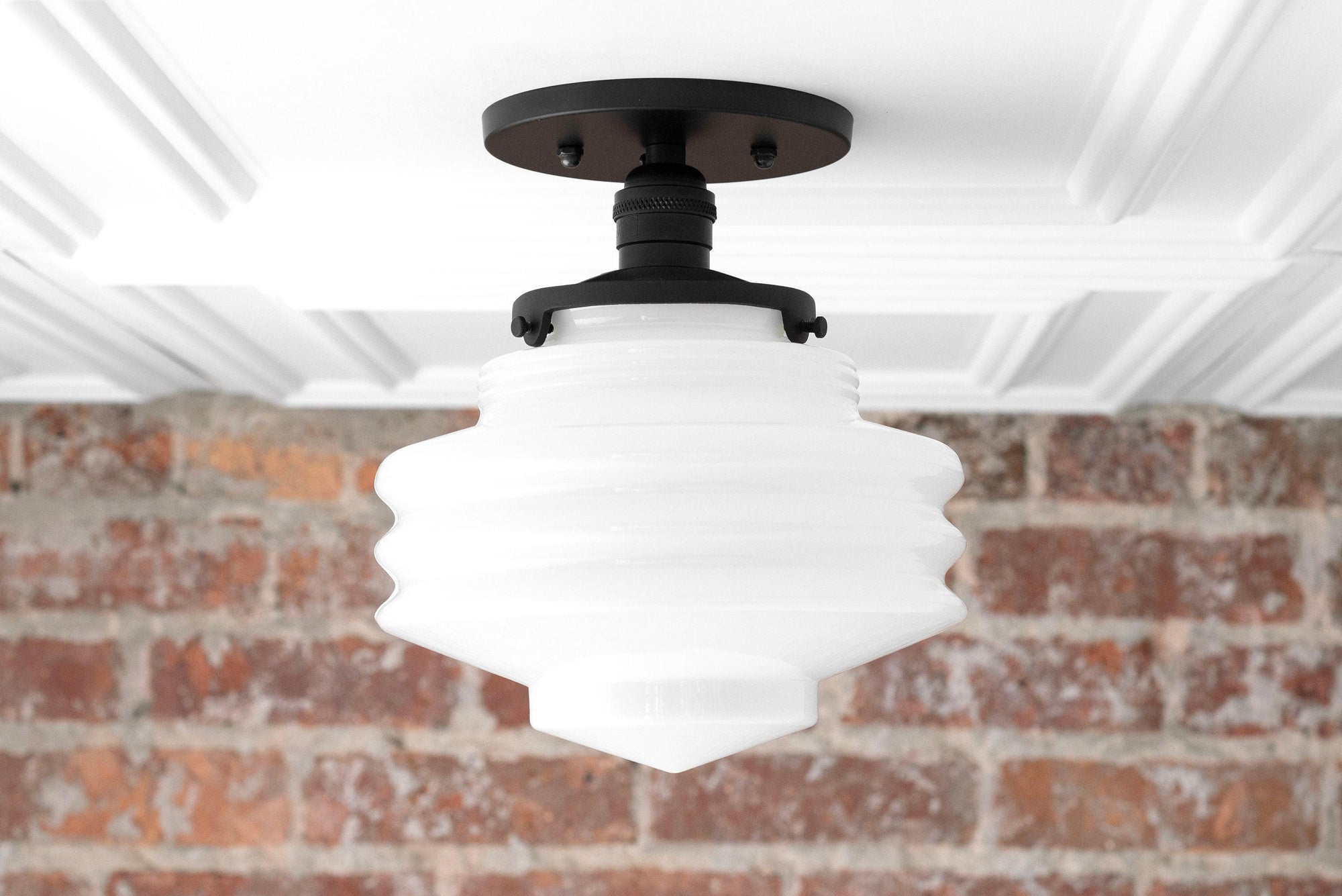 Mid-century modern white globe ceiling light with black semi-flush mount against brick wall. - CEILING LIGHT MODEL NO. 8295