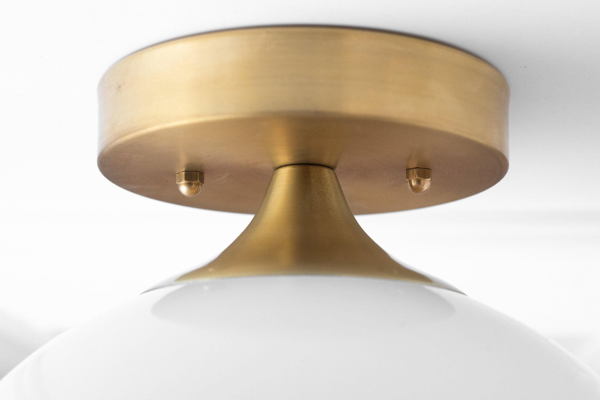 Sealed brass semi-flush ceiling light fixture with matte white glass shade and bare bulb design. - CEILING LIGHT MODEL NO. 8510