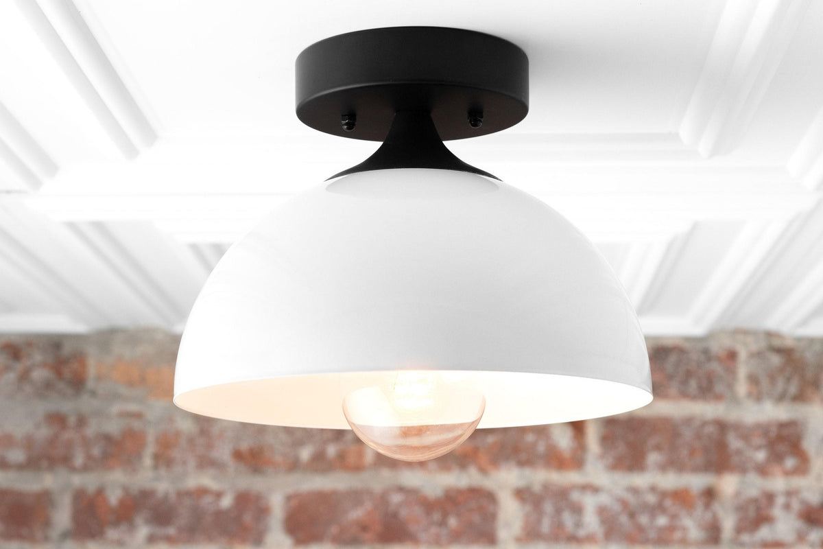 Mid-century modern semi-flush ceiling light with matte black fixture and white dome shade, exposed bulb visible. - CEILING LIGHT MODEL NO. 8510