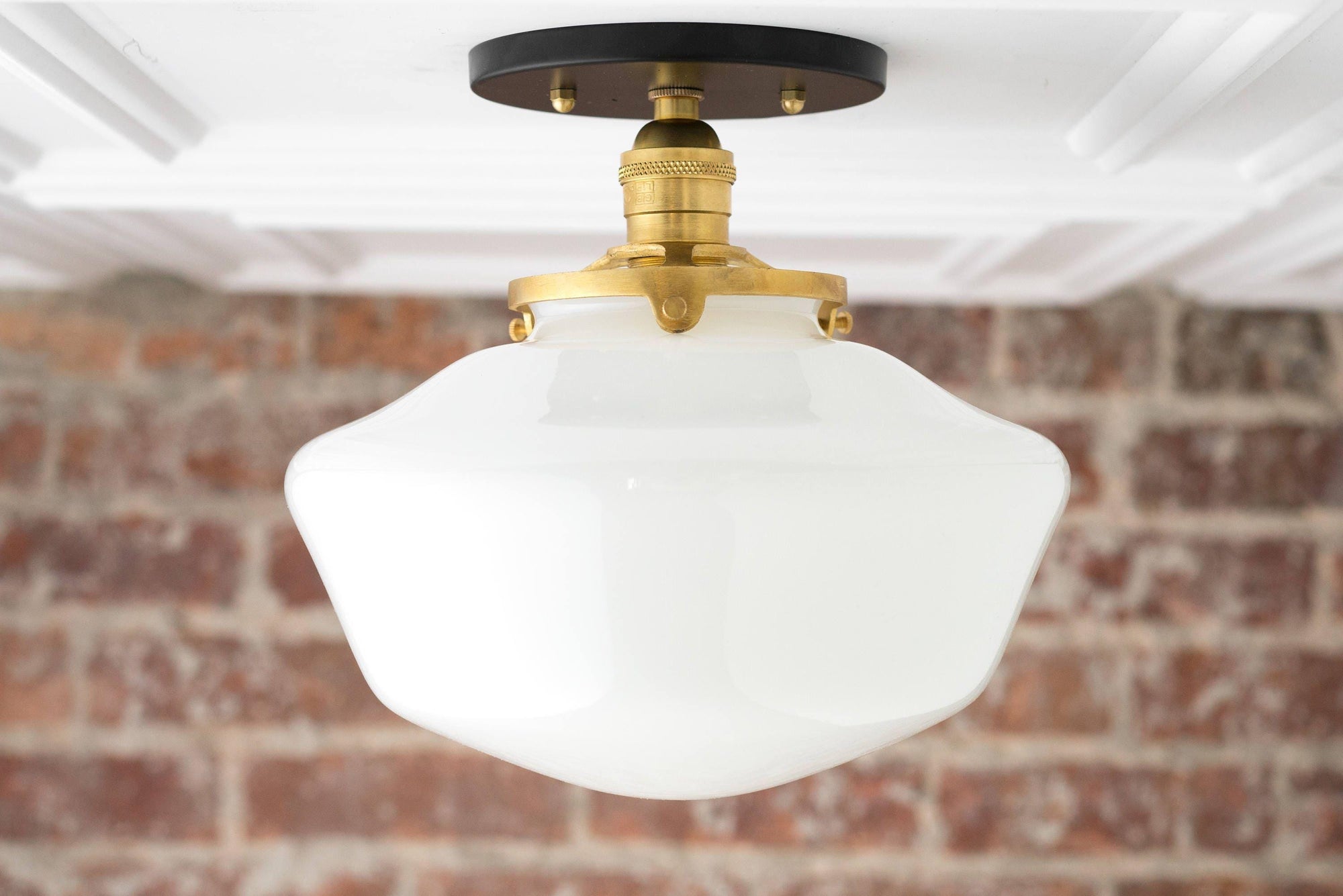 Mid-century modern semi-flush ceiling light with white globe and raw brass fixture against exposed brick wall. - CEILING LIGHT MODEL NO. 5754