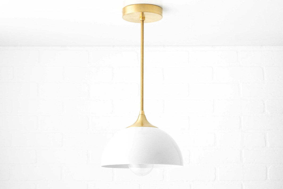 Mid-century modern pendant light with white dome shade and brass stem, suspended from ceiling mount. - PENDANT MODEL NO. 9263