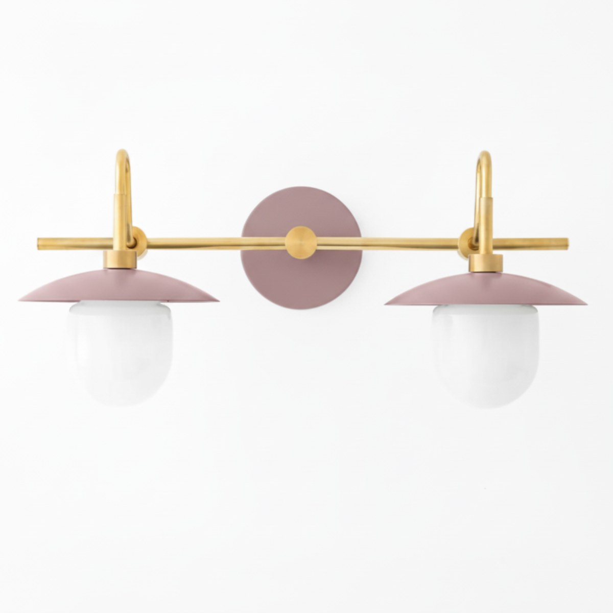 Two-bulb vanity light with matte dusty rose metal shades, brass horizontal bar, and round white glass globes. - VANITY LIGHT MODEL NO. 0347