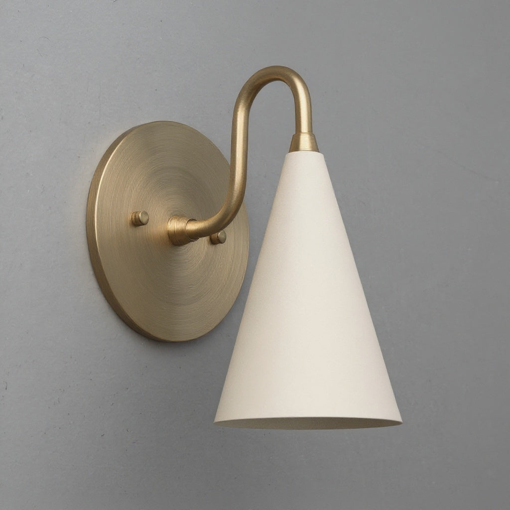 Antique brass sconce with cream-colored conical shade on round wall mount. - Sconce Model No. 2900