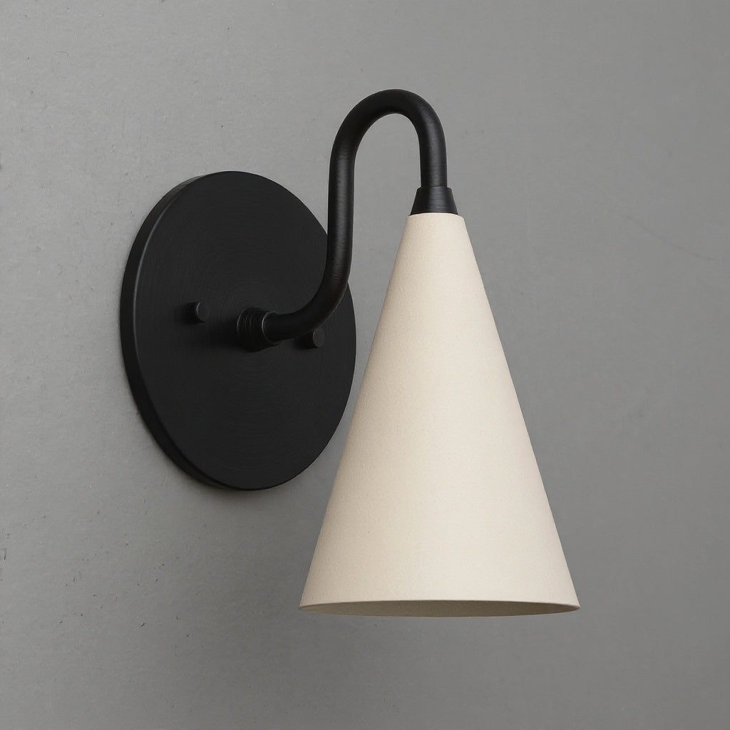 Black metal wall sconce with a matte cream conical shade mounted on a gray wall. - Sconce Model No. 2900